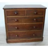 A 19th century mahogany chest, of two short over three long graduated drawers, raised on a plinth