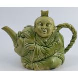 A 19th century Minton majolica tea pot, formed as a China man holding a mask, in a pale green glaze,