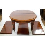 A 19th century mahogany dining table, raised on fluted turned supports, having three leaves, 47ins x