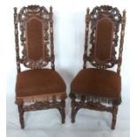 A set of six carved oak dining chairs, with flower and scroll carved backs framing an upholstered