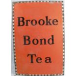 An enamel sign, Brooke Bond Tea, to an orange ground, 30ins x 20ins