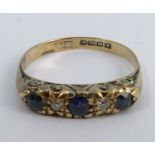 A diamond and sapphire 18 carat gold ring, finger size P, 2.7g gross