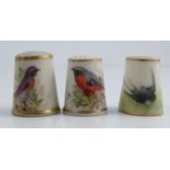 Three Royal Worcester thimbles, all painted with British birds, one signed by PowellCondition