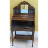 An Edwardian rosewood and inlaid ladies writing desk, with cylinder top opening to reveal a pull out