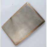 A silver slide action cigarette case, with gold coloured border, 208g (6.7 troy ozs) gross