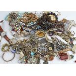 A quantity of costume jewellery, beads and wrist watches