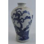 An Oriental blue and white baluster vase, decorated with a tree, flowers and butterflies,