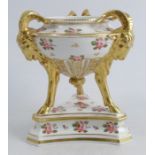 A 19th century Derby pastille burner, decorated with pink roses, with gilt rams masks and feet,