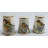 Three Royal Worcester thimbles, all painted with British birds, one signed by PowellCondition