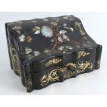 A 19th century papier mache stationery box, of shaped rectangular form, inlaid with mother of