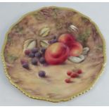 A Royal Worcester cabinet plate, decorated with fruit to a mossy background by P Love, with gilded