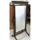A mahogany framed cheval mirror, with blind moulding to the top, the rectangular plate raised on end