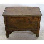 An Antique elm box, with chip carved ends to the hinged lid, with fielded front and raised on