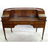 An Edwardian mahogany and inlaid Carlton House desk, with label for Druce & Co. London, the back