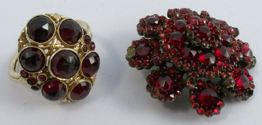 An Austrian garnet set ring, with Austrian control marks and stamped '585', set with seven principal