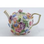 A 19th century Meissen miniature teapot and cover, encrusted all over with brightly coloured