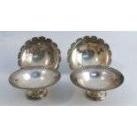A pair of silver pedestal dishes, with Classical border, London 1907, weight 5oz, together with