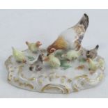 A Meissen porcelain group, of a chicken and seven chicks, circa 1930, on an oval gilt rococo base,