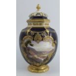 A Royal Worcester covered vase, with pierced cover, the body with dark blue ground decorated with
