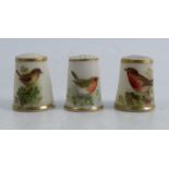 Three Royal Worcester thimbles, each decorated with English birds, no Worcester markCondition