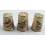 Three Royal Worcester blush ivory thimbles, all painted with British birds, unsigned and