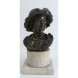 A bronze bust, of a young peasant boy, raised on a dwarf marble column, signed Diritti D'Autore,