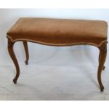 A mahogany rectangular stool, the upholstered seat on cabriole supports, 34ins x 15ins x 22ins