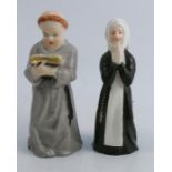 Two Royal Worcester candle snuffers, The Praying Nun and The Monk reading a book, height 4.