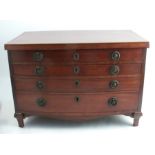 A mahogany bow front canteen of cutlery box, formed as a chest of drawers, fitted with a rising lid,