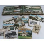 An album of postcards, to include mainly topographical views, and some portrait cards, together with