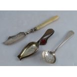 An Edwardian silver medicine spoon, with enamelled red cross, Birmingham, 1903, together with a