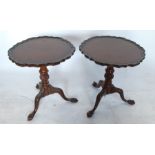 A pair of mahogany tripod tables, with pie crust edge to the circular top, raised on turned carved