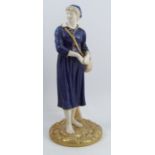 A Royal Worcester model, of a French Fisher Girl, decorated in mottled blue and gilt to a parian