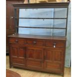 An Antique oak dresser, the rack back with two shelves, the base fitted with three short drawers