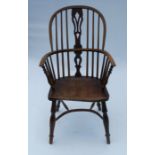 An Antique ash and elm Windsor armchair, with pierced splat to the hoop back, raised on a