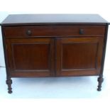 A 19th century mahogany cabinet, fitted with a long frieze drawer over a pair of cupboard doors,