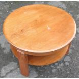 A 1930's Art Deco round walnut two tier coffee table, by Gordon Russell, standing on three fluted