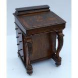 A Victorian mahogany davenport, with inset leather to the sloping writing surface, with hinged