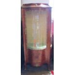 A 19th Century style kingwood vitrine, with a glazed door and marquetry panel below, having gilt