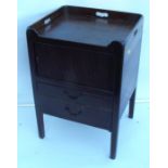 A Georgian mahogany commode, with cut out handles ot the tray top, having a tambour front