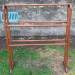 An Arts and Crafts style mahogany towel rail, with octagonal rails, height 36ins, width 31ins