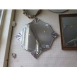 A Decorative Star Shaped Frameless Wall Mirror and two others