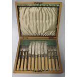 A Canteen of Six Silver Plated and Ivory Handled Fruit Knives and Forks