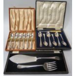 A Cased Set of Silver Plated Fish Servers and two cased sets of grapefruit spoons