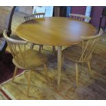A Set of Four Ercol Candlestick Chairs and drop leaf circular table