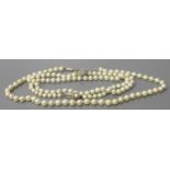 A Cultured Pearl Necklace with 9ct gold clasp and a costume ring