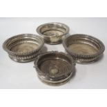 A Pair of Sheffield Plated Silver Wine Coasters and two others