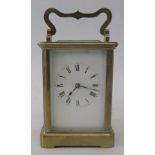 An English Brass Carriage Clock, 16cm to top of handle, running