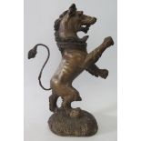 A Carved, Gesso and Painted Figure of a Lion Rampant with coronet around neck, 18th century or