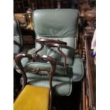 A Large Ekorness Light Green Leather Reclining Armchair with stool